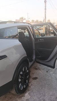 كيا سبورتج للبيع   امريكي موديل 2023 لون سموك  - ضرر السيارة صندوك جنط...