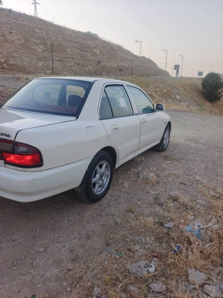 بروتون 2004 نمونةية لةجواني ئوتوماتيك ئارم بلاستيك جوارتاية لوك بةشةرتي كيرو مكينة تةبريد لةسةر سويج سةيارة قرجي نيية لوك لوكة  ***********////////*********** دار بنديهكان, السليمانية
