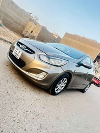 للبيع أكسنت  2013 رقم بغداد الجديد  هزه جديده  سنويه جديده بأسمي تحويل...