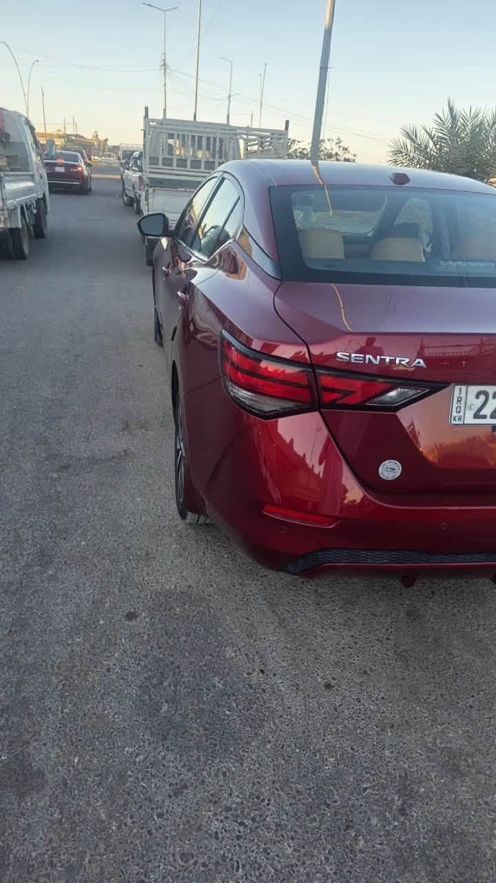 🚗 نيسان سنترا 2021 - SV (رقم اربيل  فول مواصفات)
اللون: ماروني
المحرك: 4 سلندر بسعة 2.0 لتر
كير: أوتوماتيك CVT
​فتحة سقف
​ تشغيل عن بعد + بصمة أبواب (دخول ذكي).
​رادار أمامي / مانع اصطدام مع فرملة طوارئ تلقائية.
 كشف النقطة العمياء 
​ تحديد وتنبيه الخروج عن المسار.
​رادار خلفي / فرملة طوارئ عند الرجوع للخلف.
​تثبيت سرعة ذكي  (Adaptive Cruise Control).
​شاشة لمس كبيرة تدعم Apple CarPlay و Android Auto.
​كاميرا خلفية دوارة
​تكييف مع تحكم مستقل السايق والراكب
​كوشن جلد كهربائي  تدفئة للمقاعد 
​ تحكمات ستيرن
​ويل كب ألمنيوم حجم 17./***********/بس شراي يدخل بله زحمه خوان رقمي بي واتساب
