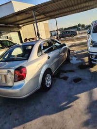 اوبترا 2004 كير عادي صدر خلفي وامامي جديد محرك خير من الله  تبريد شغال...