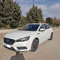 MG6   MODEL  2021 ڕەنگی سپی  ناوی ڕەش و بێجی وەک لە وێنەکاندا دیارە . ...