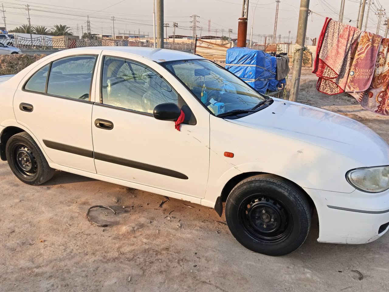 السلام عليكم نيسان سني ياباني موديل 2005
 محرك قبق اسود مكينه بيها تنقيص بدون بخار فقط تنقيص گير اوتماتيك رقم قادسيه مشروع وطني حداديه 80% البدي شوفت عينك بي طخات بسيطه السيارة احلى من الصور السعر 75 وبيها مجال قليل للاستفسار ***********
