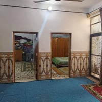 ١٥٠م • غرفتين • سايدين شارع المطار