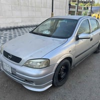 للبيع استرا 2002 بسمي السياره بس جراد مابيها اي ضربه المكان بغداد  هات...
