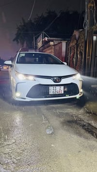 كورلا هايبرد فول مواصفات موديل 2024  ماشية 20 الف  بحالة الوكالة مكفول...