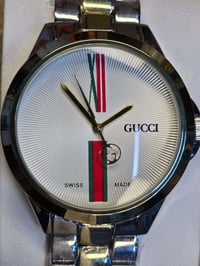 ساعة غوتشي • حركة كوارتز • سوار ستيل فضي