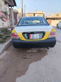 لانسر موديل ٢٠٠٩ سياره بيه ضربه جاملغ امامي معمره گير ومكينه خير من ال...