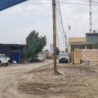 قطعه ارض 100 م عرض الشارع ٦ م  طريق المطار  شارع حسينيه ابو عبير  للاس...