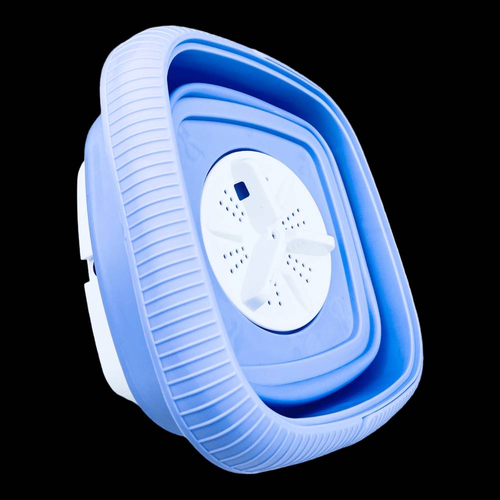 غسالة ملابس محمولة صغيرة الحجم بلون أزرق، تتميز بتصميم مدمج يناسب السفر والاستخدام السريع. توفر خيارات زمن مختلفة للطحن من دقيقة إلى عشر دقائق. مثالية لتجفيف الكميات الصغيرة من الملابس بسهولة.