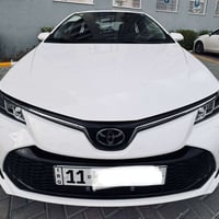 تويوتا كورلا هايبرد 2025 رقم بغداد  ماشية 24 الف كيلو ام الضمان شركه ا...
