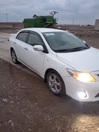 كورلا للبيع 2013 مكينه 18 مامفتوح بي كوبون بانزين السياره باسمي 075032...