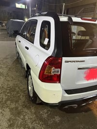 سبورتج ٢٠١٠ • ابيض • ماشي ٢٤٥ الف