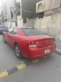 دودج جارجر موديل 2010 رقم بغداد باسمي  سونار موجود بيها قطعتين صبغ بدو...