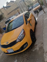 كيا ريو للبيع موديل 2015 ضربتها داخل العراق موضحه بالصور  السعر 80 وبي...
