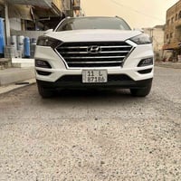 هونداي توسان خليجي موديل ٢٠٢١  رقم بغداد الماني بسمي  لون ابيض  ٤ سلند...