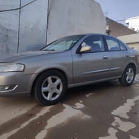 نیسان سەنی 2011 ی کۆری گێر ئۆتۆماتیک  فول مواسەفات رەنگی برۆنزی 4جام ک...