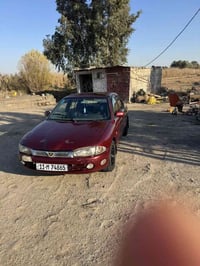 بروتون • ٢٠٠٥ • باسمي