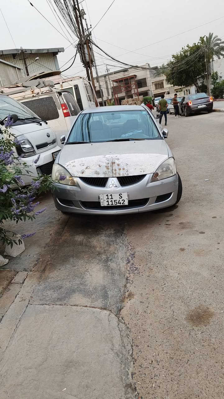 لانسر بومة موديل 2004  الشركة العامة للسيارات  كير عادي رقم بغداد انكليزي   هزة وسنوية جديدة الى 2031  تبريد شغال  صدر نظيف تايرات نظيفة والكشر شوف العين  مكان السيارة بغداد السعر 53. للاستفسار الاتصال على ***********      *********** ابوريحانة
