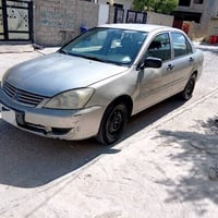 لانسر ٢٠٠٩ • اوتوماتيك • اربيل