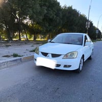#سيارة ميتسوبيشي لانسر GLX  موديل ٢٠١٠ رقم كربلاء الماني الجديد مميز م...