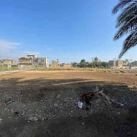 أرض ٢٠٠م • قرب شارع الخدمي • ماء كهرباء مجاري