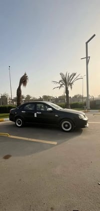 فورنزا موديل 2007 رقم بغداد الجديد تبريد كير محرك كفالة سيارة بدون ضرب...