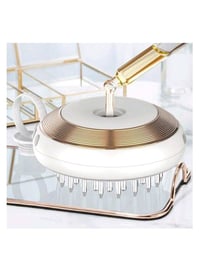 فرشاة تصفيف أو تدليك لفروة الرأس، وتتميز بـ: خزان سائل: تحتوي على خزان...