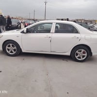 كورلا 2012 رقم نينوى الماني محرك18 ضررها بارد بالسقفيه حافه باب الخلفي...