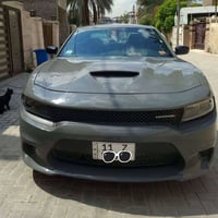 دوج چارجر 2023 GT اخر اصدار اللون اسمنتي مميز العداد 58 الف مايل الضرر...