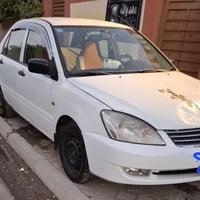 لانسر  ٢٠٠٦ وارد خليجي مابيهة ضرر بس خياس مسوي رقم بغداد    مميز ٤ ارق...