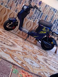 حي قام • قبله • دراجة كهربائية