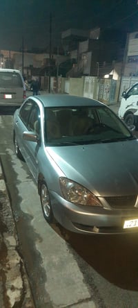 لانسر ٢٠٠٧مصبوغه رقم شمالي  مكاني بغداد ٠٧٧٣٥٥٥٧٨٦٩