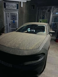 جارجر 2023 الفئة SXT لون مميز ( إسمنتي)  السيارة وارد امريكي الضرر مثل...