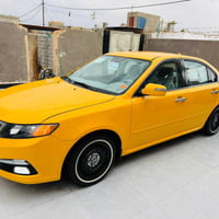 أوبتيما ٢٠١٠ • ٢٤٠٠ سي سي • نمر مصفره