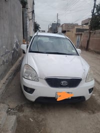 اخوان كيا كارنز موديل 2012  7 راكب  رقم بغداد انكليزي  مكينه نظيفه كير...