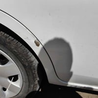 نيسان سني 2024 ابيض اللون ماشية 21000 للبيع رقم بغداد بيها ضمان من شرك...