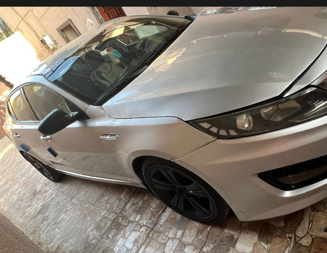 اوبتيما ٢٠١١ وارد امريكي رقم اربيل  محرك ٢٠٠٠ دوش كير محرك تمام لون سلفر مصبوغه حزام ضرر جاملغ امامي واصله للداخل وبنيد مبدل  سياره حلوه وجاهزه من كلشي مكان السياره الرمادي السعر ٩٠ وبيها مجال  بيع او مراوس بكامري او كورلا التواصل على الرقم ***********
