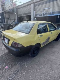 لانسر موديل ١٠  جامرلغ امامي مبدل وبيها طخه بل باب الخلفي خط بعقوبه كن...