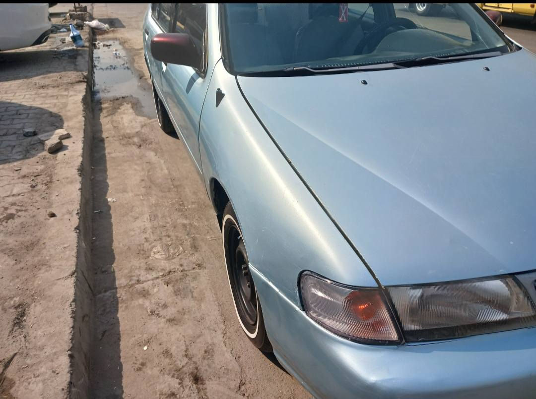 #سيارة نيسان سينترا موديل ١٩٩٥  ياباني #للبيع
لون سمائي.بلادي كير ومحرك.رقم شاصي  لجميع القطع واحد (مامبدل بيهه شي).حداديه ١٠٠ % . غرفه جديده ومغلفه بلاستك دواخل مريحه دوشمه مرتبه . لايتات سكنات اشارات مسجل جميع الكهربائيات شغاله. تايرات جديده ام خط الابيض . سياره  ماناقصهه شي عدا التبريد مامصلحه الا المشتري ايريد يضيف عليهه هو حر.رقم دولي انكَليزي وبأسمي وسنوية لل٢٠٢٦رقم بغداد (11) حرف (M)سويج سنتر لوك عدد ٢
شرط المداور. مكان السياره نجف.وارد امريكي
سعر السياره  53 $ورقه (بيهه مجال بسيط)
رقم الاتصال *********** (واتساب)
