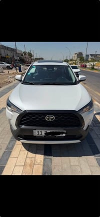 كورلا كروس 2025 هايبرد رقم بغداد بسمي مكفوله من صبغ و البارد و التبديل...