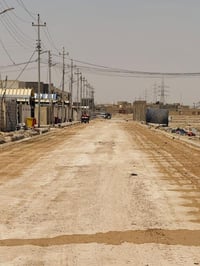 بوابة المثنى • تسوية شوارع • تبليط