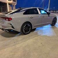 Kia k5 2023 GT line محرك 1600 تيربو   اللون سمنتي   الرقم بغداد   مواص...