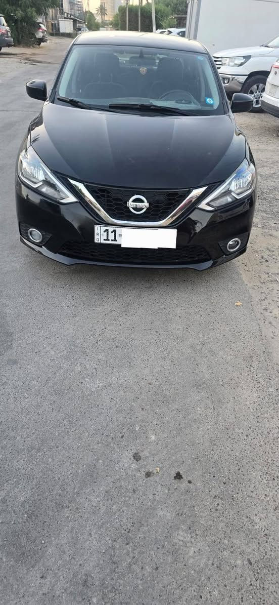 نيسان سنترا موديل 2019 لون اسود بغداد  نوع SV محرك 1800 المرغوب
حادثها جامغ وبنيد ومبدلات وبيها كم قطعه صبغ وبيها شبر حار باب السايق جوه يده الباب موصفاتها معروفه السيارة بغداد ومكان السيارة بغداد بااسمي  بصمه تشغيل وبصمه ابواب  تحكم استيرن جهتين تدفئة تبريد حساس اطارات  السيارة خير من الله  هاي الصور كدامك شوفت عينك السيارة كلها كاعدة ومليون عافية للياخذها ويتهنى بيها ان شاء لله سعرها 95 $ ورقه وبيها مجال  وكلمن يكدر يشتري على كد امكانيته الشراي يتصل *********** بغداد, العراق

