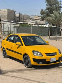 كيا ريو 2009امريكي رقم بغداد شرط الوكاله والتحويل  بيها 3قطع تبديل وبي...