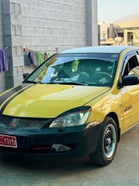 سلام علیکم ئەم سەیارە بۆ فرۆشتن لانسەر 2010 سەنەوی جنوبە  گێڕ و مەکینە...