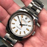 رولكس ميلغوس • مينا أبيض • علامات برتقالية