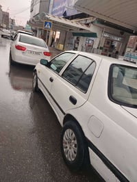 نيسان للبيع سيارة مكينه وكير شرط طخم جديد شرط التحويل وايرمنيه شغاله ب...