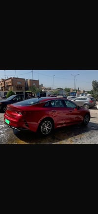 للبيع كيا K5 2023 لون احمر   مغلفة ppf جديد كل ٦ اشهر بالضمان  الممشى ...