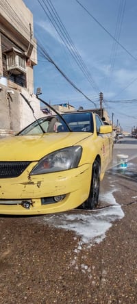 لانسر للبيع 2009 سنوية 27 الكشر واضح بالصور الضرر صار فقط بقبق الجنطة ...